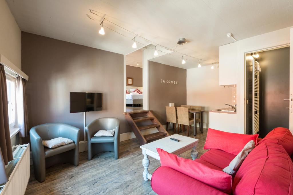 Quad room living area at Hotel Leopold